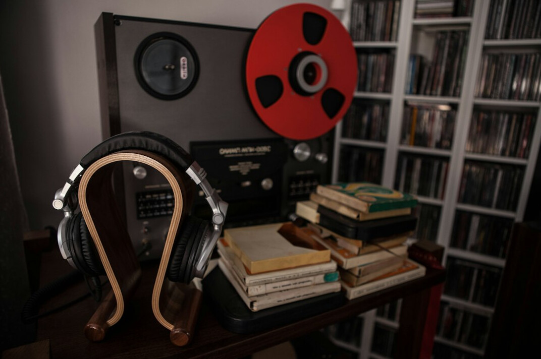 Vintage home recording studio with analog mixing console and vinyl records