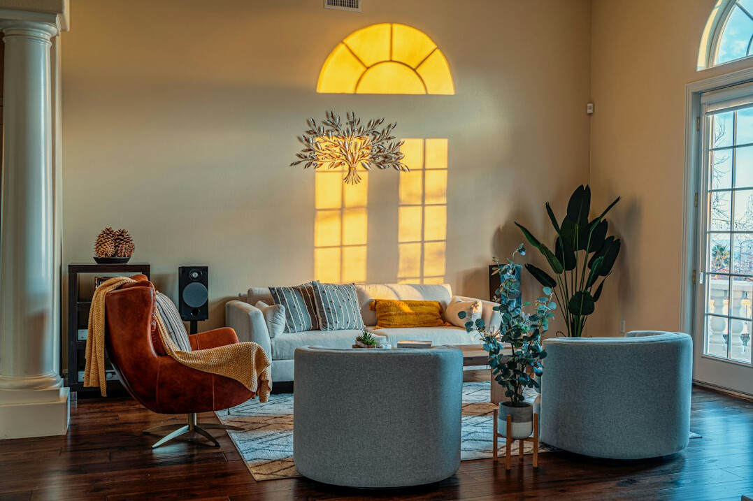 Elegant retro-style living room with velvet armchairs and brass lighting